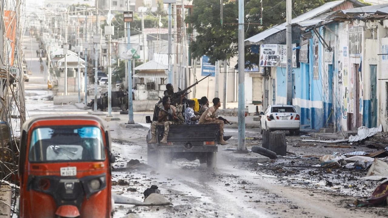 Somali security officers drive past a section of Hotel Hayat, the scene of an al Qaeda-linked al Shabaab group militant attack in Mogadishu, Somalia. Credit: Reuters Photo