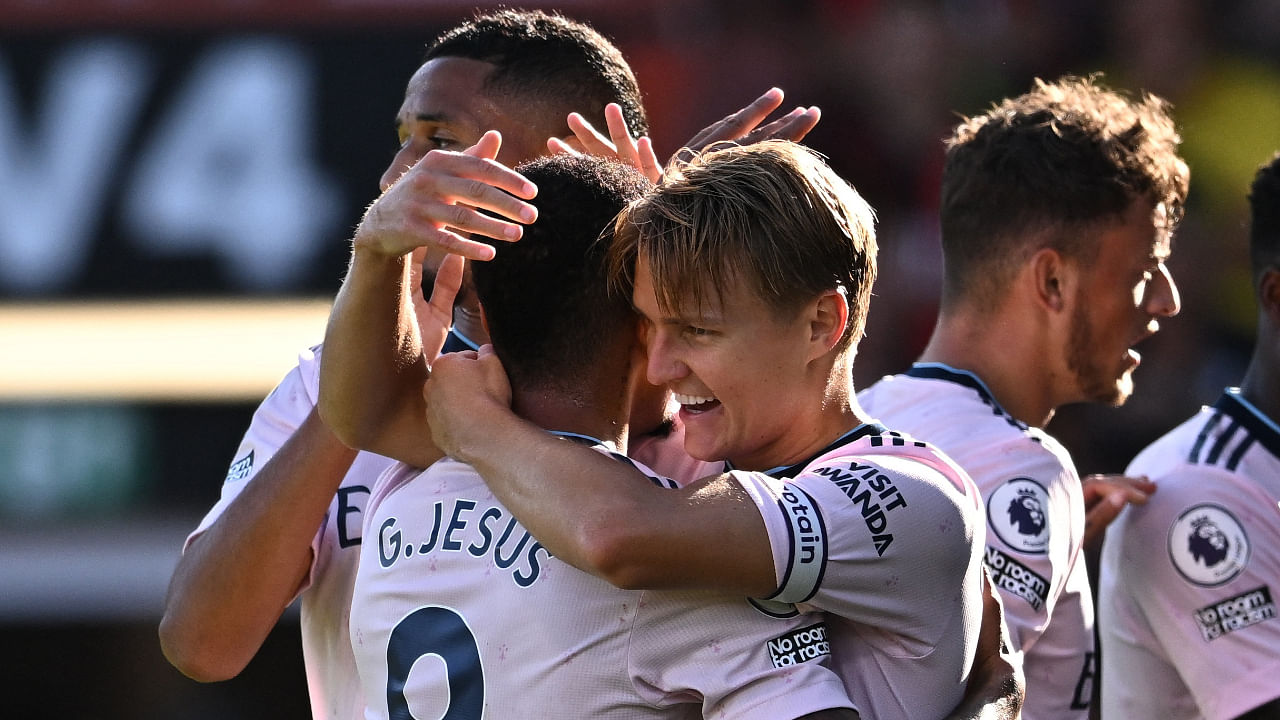 Arsenal's Martin Odegaard celebrates scoring their second goal with Gabriel Jesus, August 20, 2022. Credit: Reuters Photo