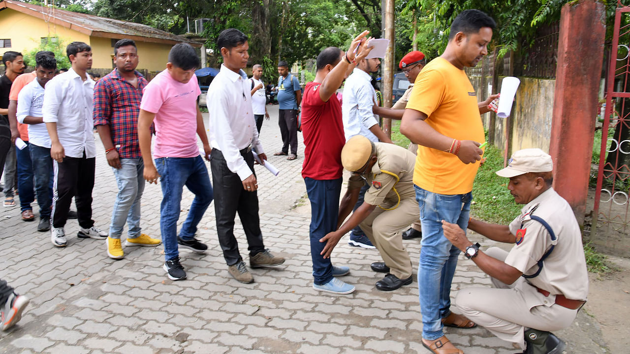 <div class="paragraphs"><p> Assam Police personnel check candidates as they arrive to appear in class III &amp; IV posts' exams at Tezpur in Sonitpur district of Assam. </p></div>