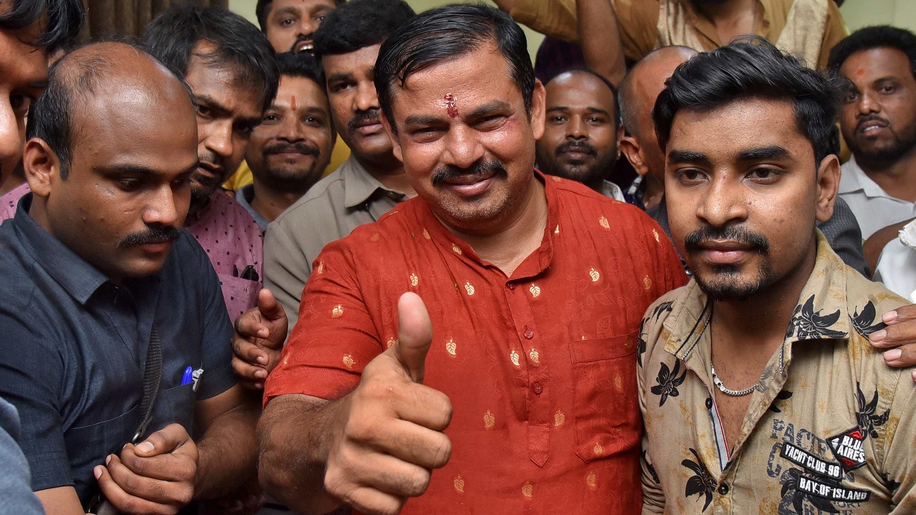 T Raja Singh,  Telangana Bharatiya Janata Party (BJP) MLA , gives the thumbs-up after he was released on bail by a court, following his arrest, at his home in Hyderabad. Credit: Reuters Photo