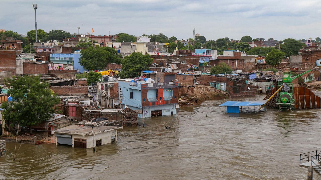 Houses submerged by a swollen river after release of a large amount of water from the Kota dam owing to heavy monsoon rainfall, in Kota, Wednesday, Aug 24, 2022. Credit: PTI Photo