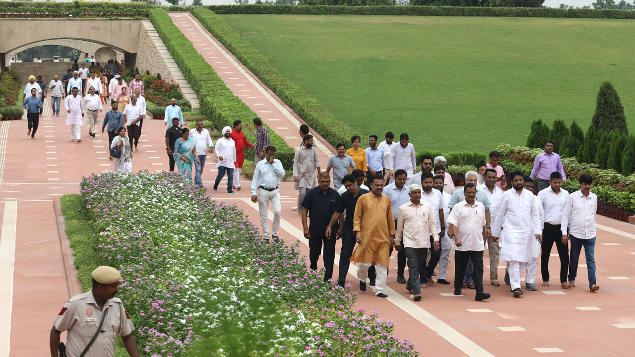 Delhi Chief Minister and AAP Convener Arvind Kejriwal with party MLAs leaves after paying tribute to Mahatma Gandhi, at Rajghat in New Delhi, Thursday, August 25. Credit: PTI Photo