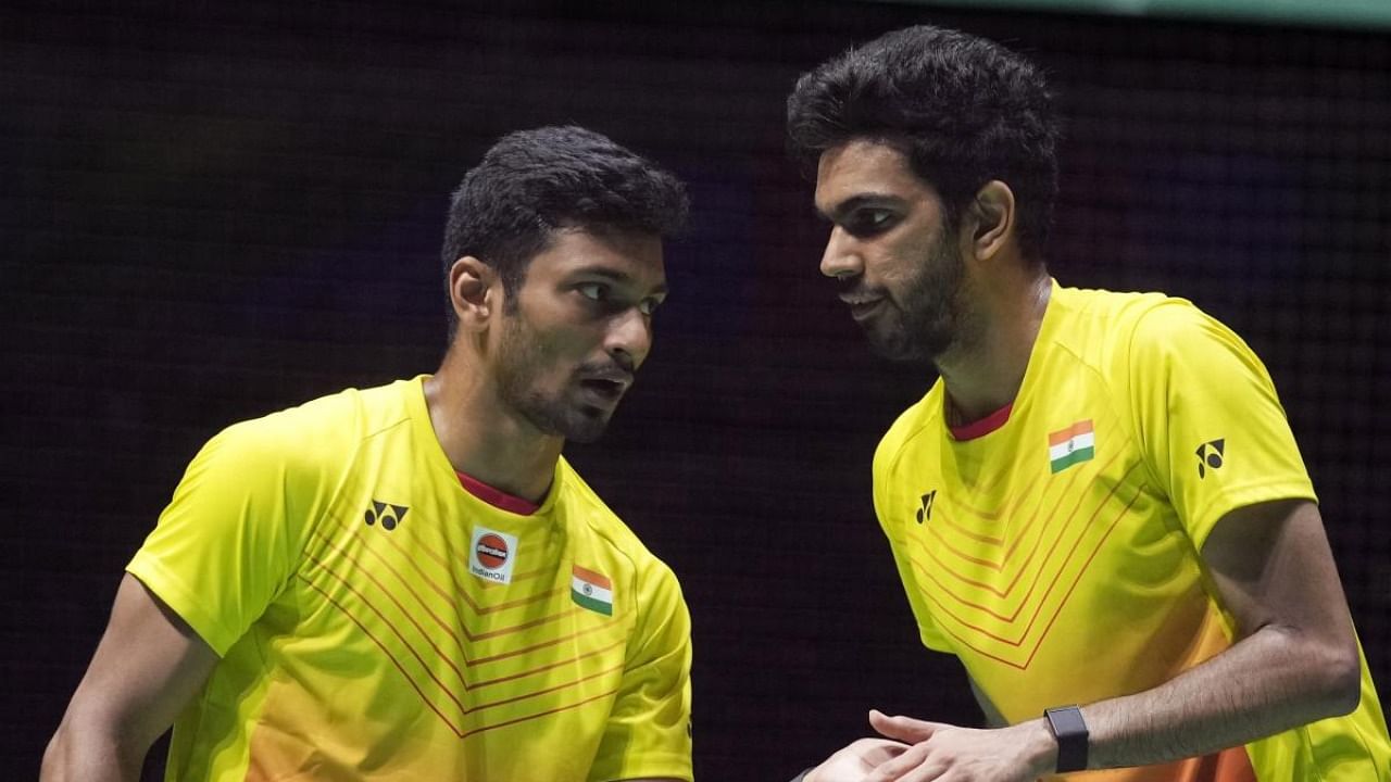 M.R. Arjun, left, and Dhruv Kapila of India compete in a badminton game of the men's doubles against Kim Astrup and Anders Skaarup Rasmussen of Denmark in the BWF World Championships in Tokyo, Wednesday, Aug. 24, 2022. Credit: AFP Photo