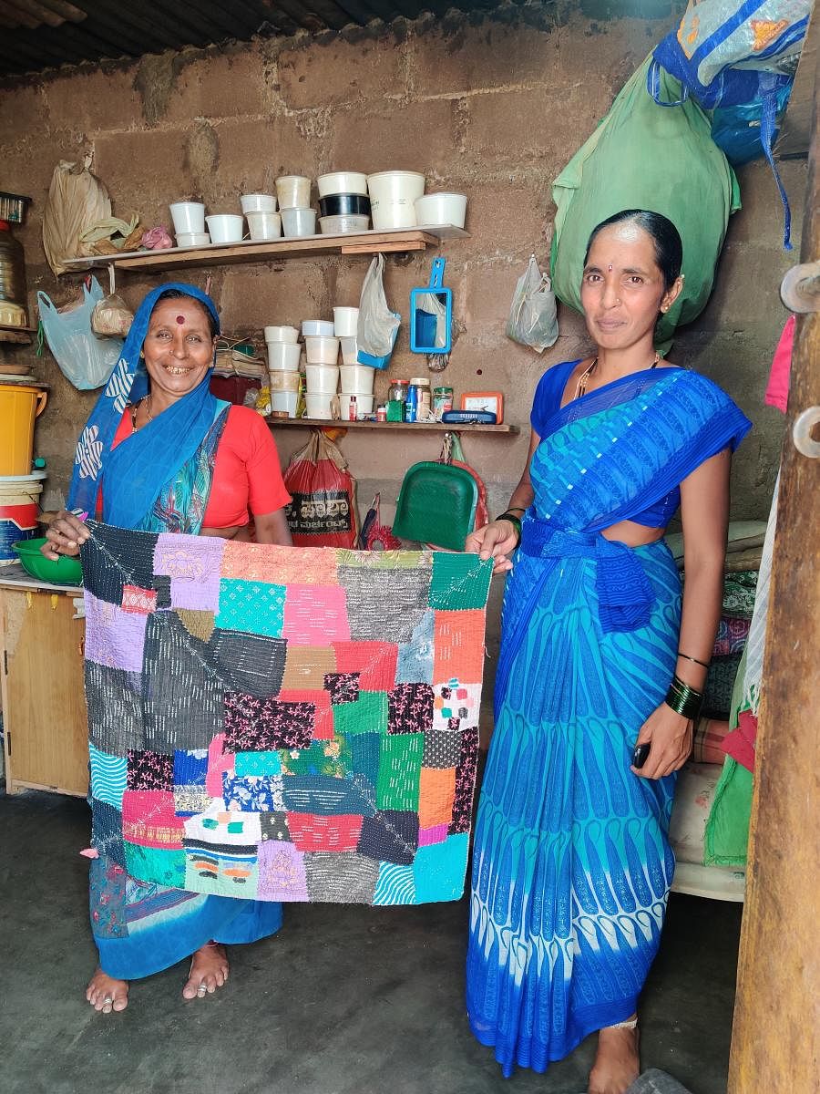 Susheelamma and Chandrakala with a thottilu gowri, a quilt made for babies.