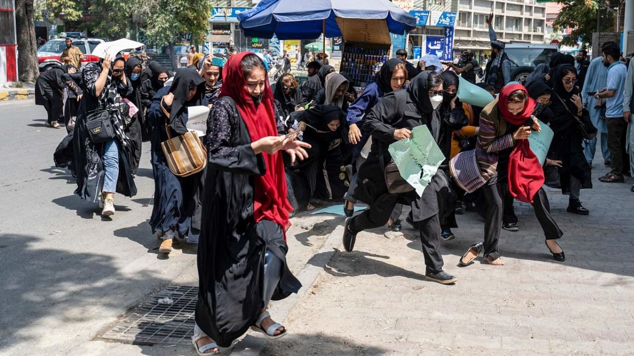 Taliban fighters fire in air to disperse Afghan women protesters in Kabul. Credit: AFP Photo