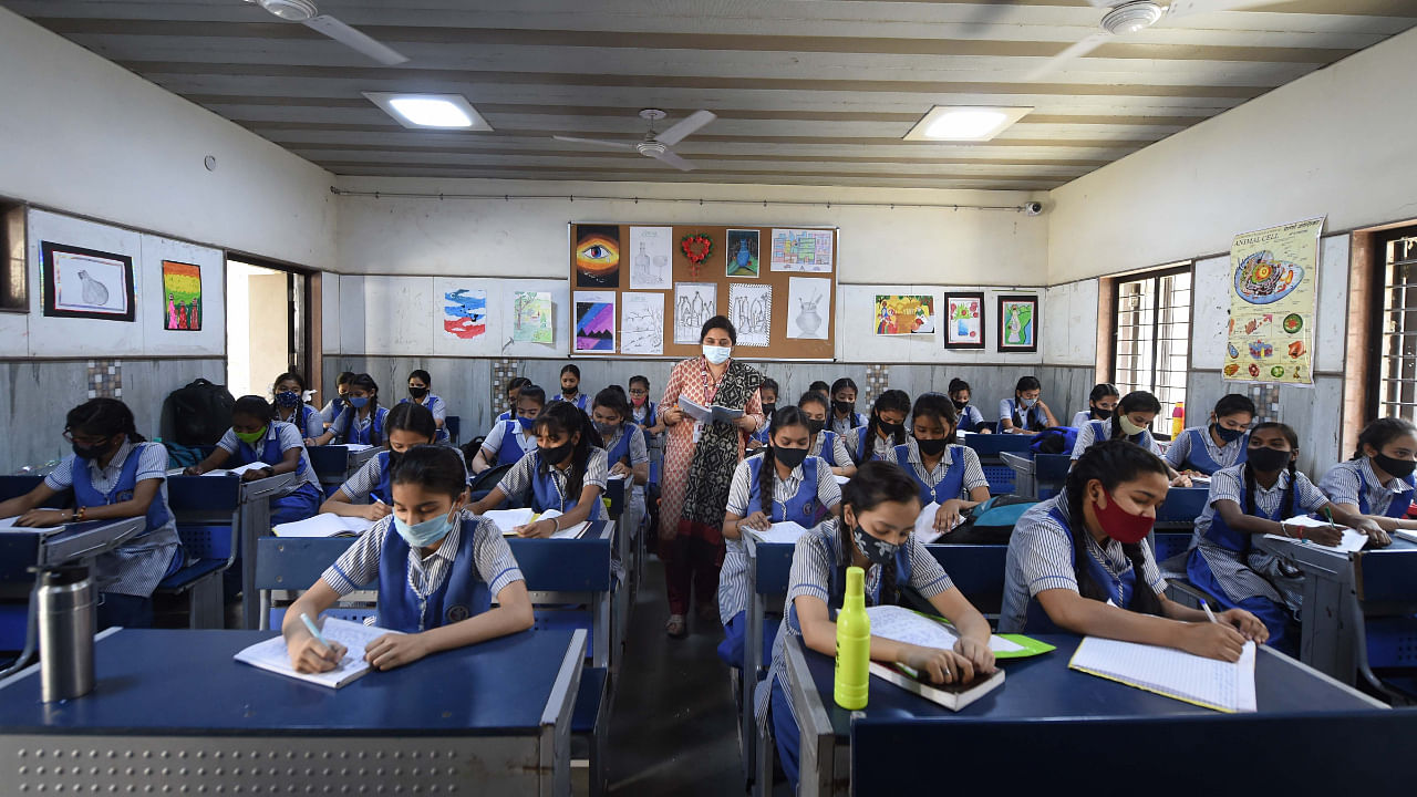 Students attend a class at a government school at Vinod Nagar, in New Delhi, Friday, April 1, 2022. Credit: PTI File Photo