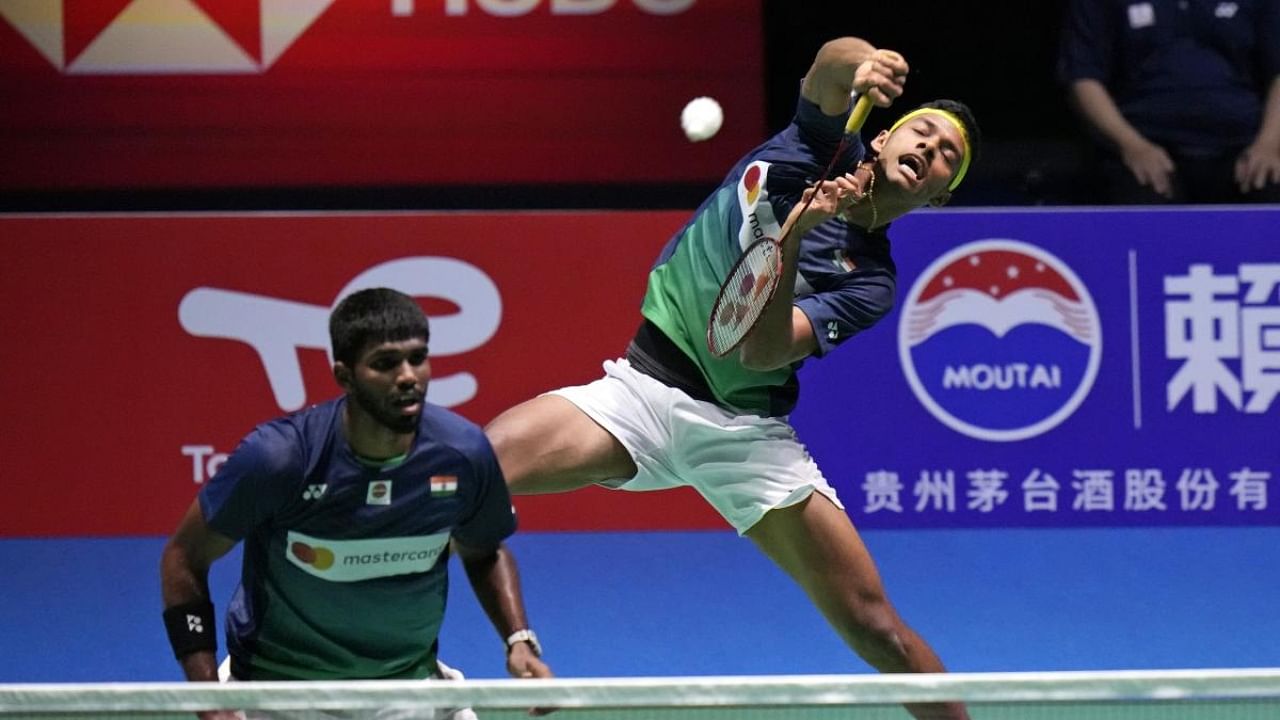 Satwiksairaj Rankireddy, right, and Chirag Shetty compete during a badminton game of the men's doubles quarterfinal against Japan's Takuro Hoki and Yugo Kobayashi in the BWF World Championships in Tokyo, Friday, Aug. 26, 2022. Credit: AP/PTI
