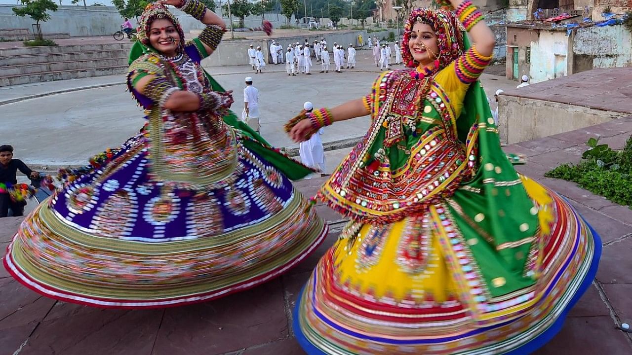 Dancers, dressed in traditional attire, take part in 'Garba' dance. Credit: PTI File Photo