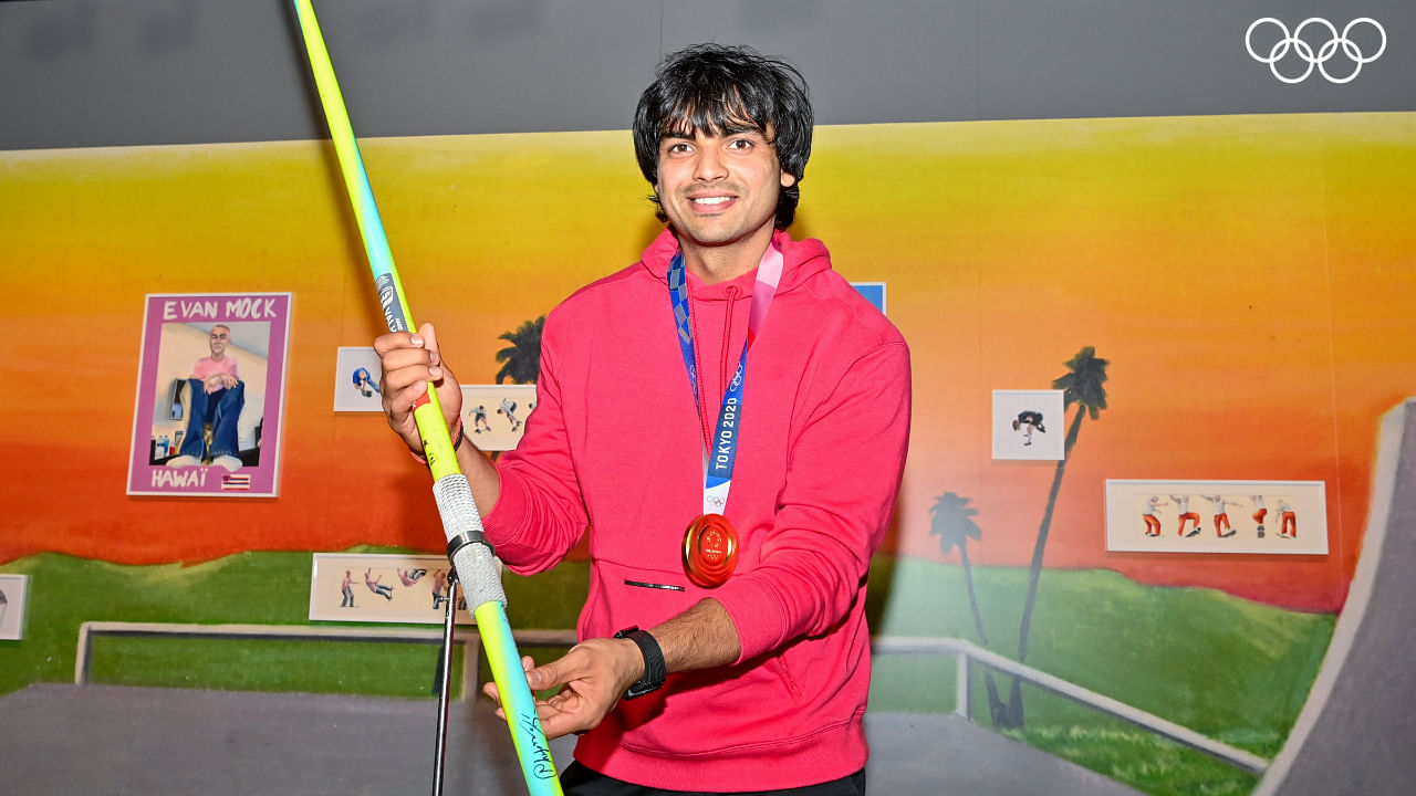 Neeraj Chopra poses with his javelin that won him the gold medal at the Summer Olympics 2020, at The Olympic Museum in Lausanne, Switzerland, August 27, 2022. Credit: PTI Photo