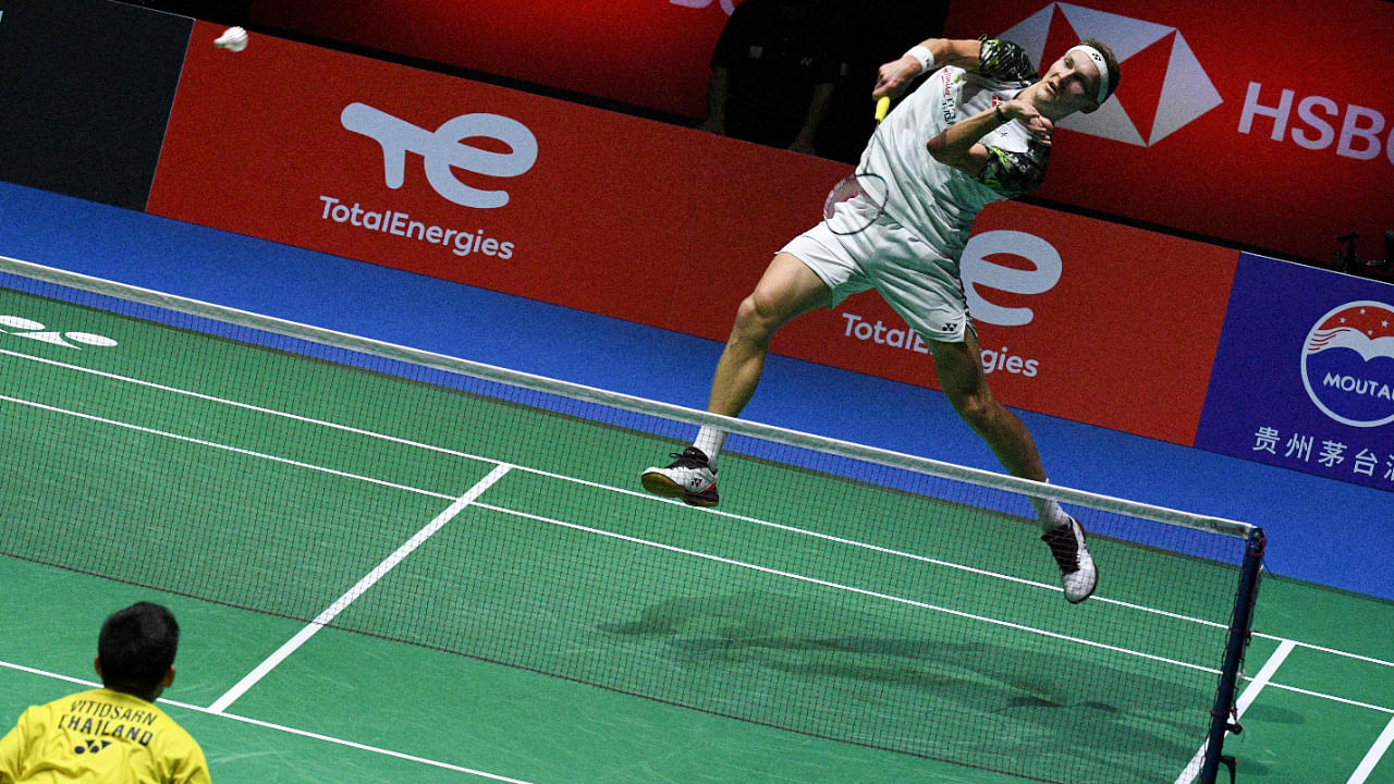 Viktor Axelsen of Denmark hits a return against Kunlavut Vitidsarn of Thailand during their men's singles final match at the World Badminton Championships in Tokyo on August 28. Credit: AFP Photo