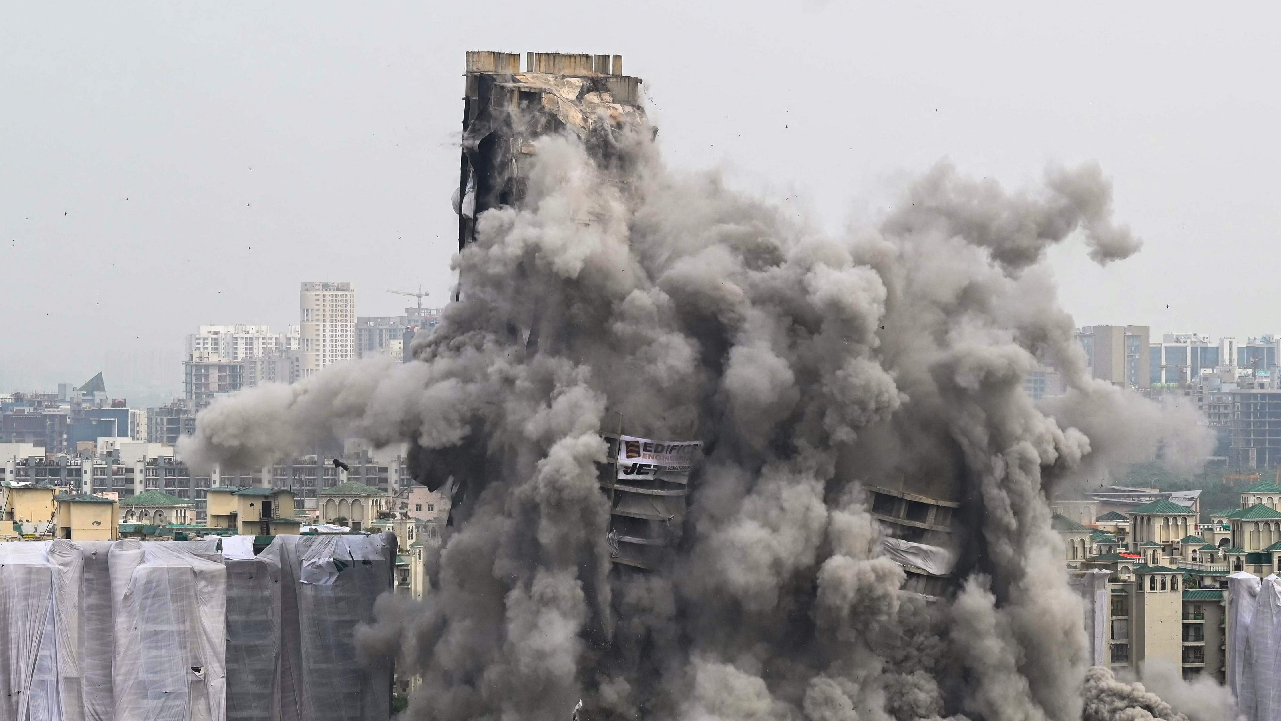 Hours after the twin towers in Noida were razed to the ground, BJP blamed the Samajwadi Party for allowing the project to come up. Credit; AFP Photo