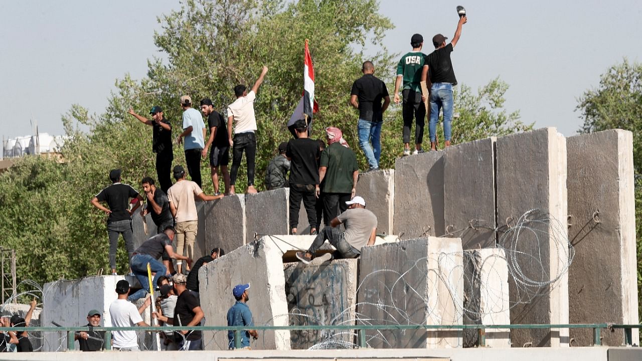 Supporters of Iraqi populist leader Moqtada al-Sadr protest at the Green Zone in Baghdad. Credit: Reuters Photo