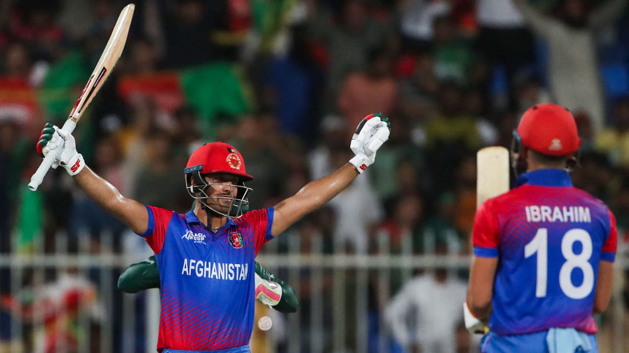 Afghanistan's Najibullah Zadran (L) celebrates after hitting a boundary to win their Asia Cup match against Bangladesh, August 30, 2022. Credit: AFP Photo