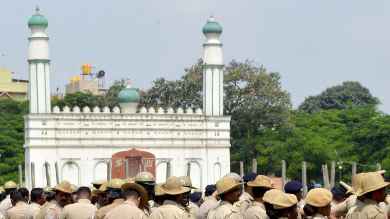 Police personnel deployed at the disputed Idgah Maidan after Karnataka government has permitted the ground to be used for Ganesh Chaturthi celebrations, at Chamarajpet in Bengaluru on Tuesday, Aug 30, 2022. Credit: IANS Photo