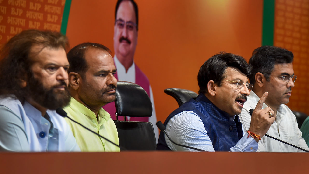 BJP MP Manoj Tiwari with party MPs Pravesh Verma, Ramesh Bidhuri and Hans Raj Hans addresses a press conference at BJP headquarters, in New Delhi. Credit: PTI Photo