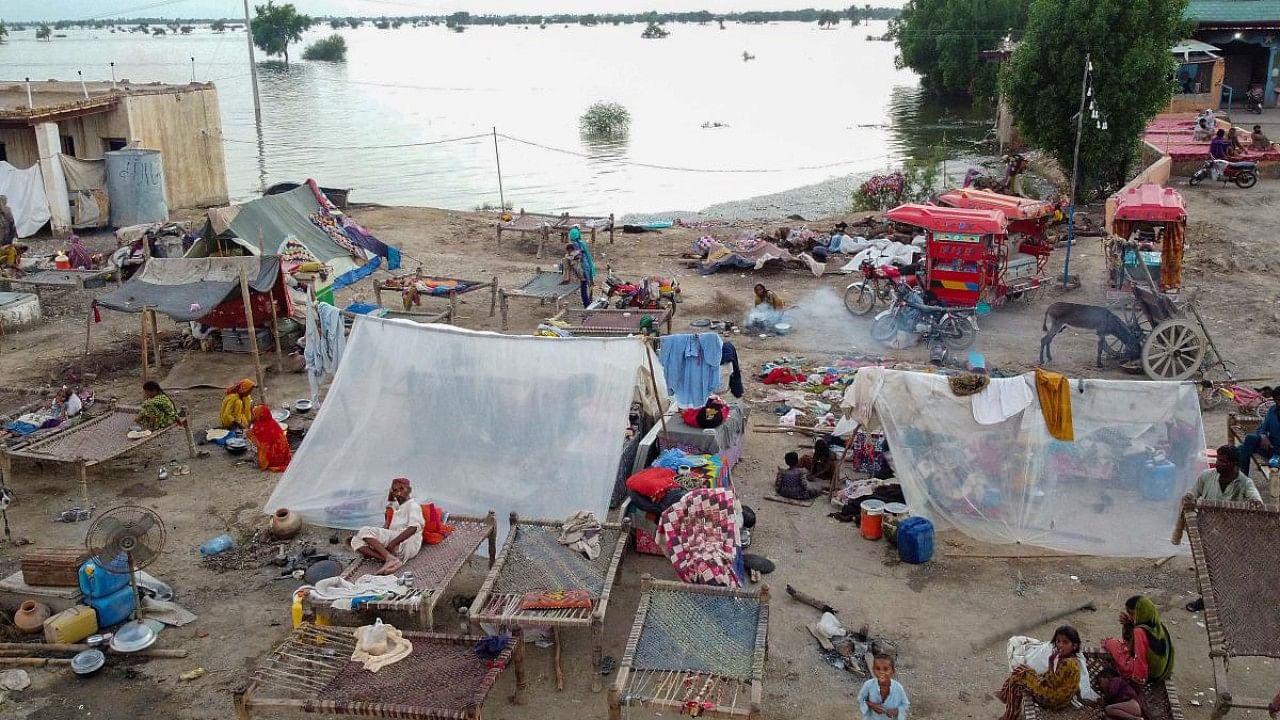 This aerial photograph shows flood-affected people taking refuge in tents after heavy monsoon rains in Dera Allah Yar town of Jaffarabad district, Balochistan province. Credit: Reuters Photo