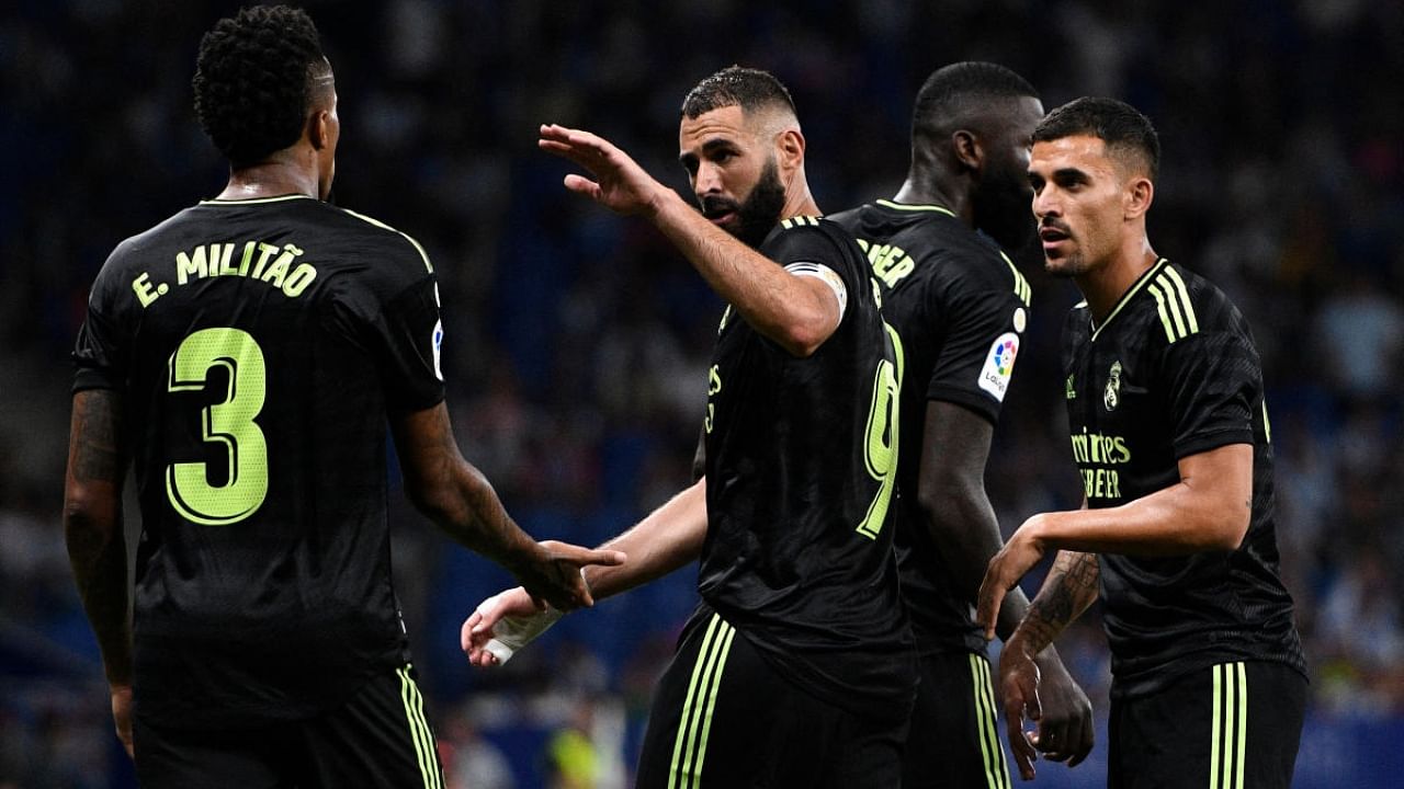 Real Madrid's Karim Benzema celebrates with teammates during the match between RCD Espanyol and Real Madrid CF. Credit: Reuters Photo