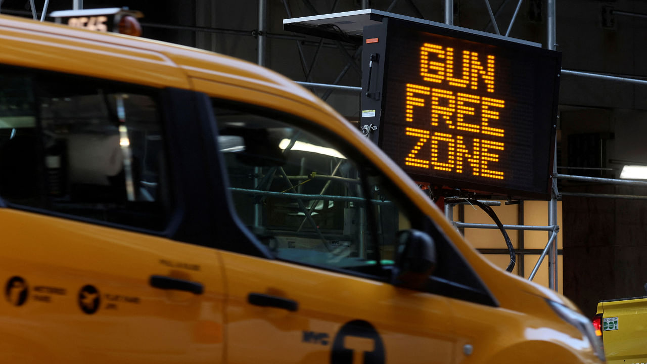 A sign similar to what is to be placed in the Times Square "gun free zone" is seen after a news conference with New York Governor Kathy Hochul and New York City Mayor Eric Adams, August 31, 2022. Credit: Reuters Photo