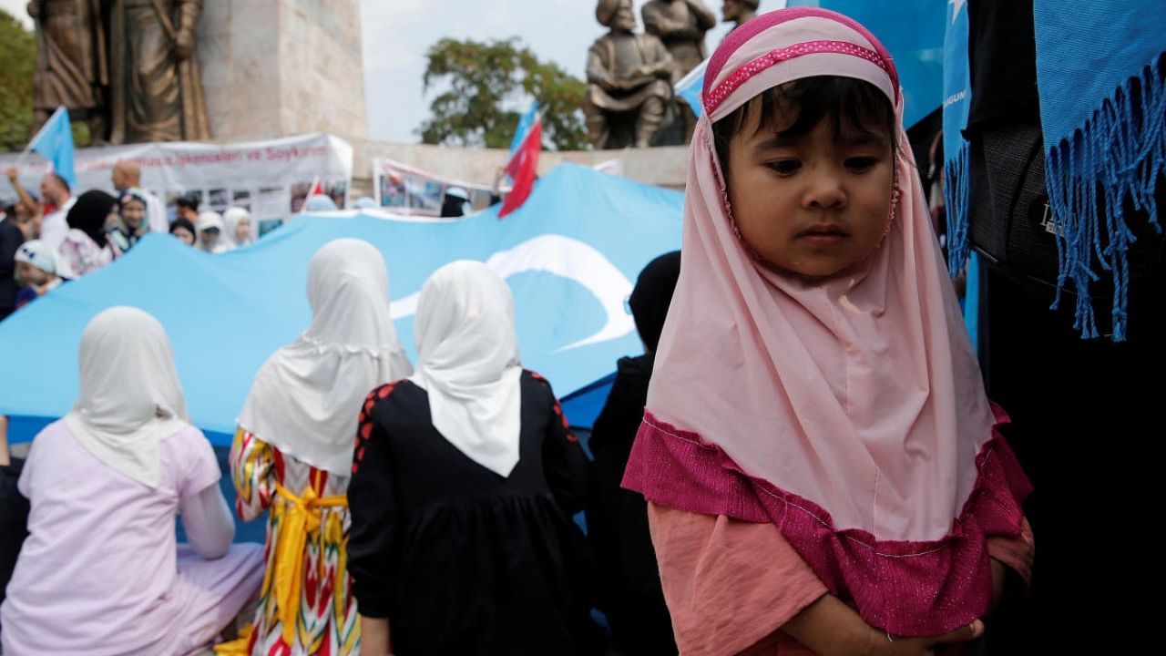 Ethnic Uyghur girls attend a protest against China, in Istanbul, Turkey August 31, 2022. Credit: Reuters Photo