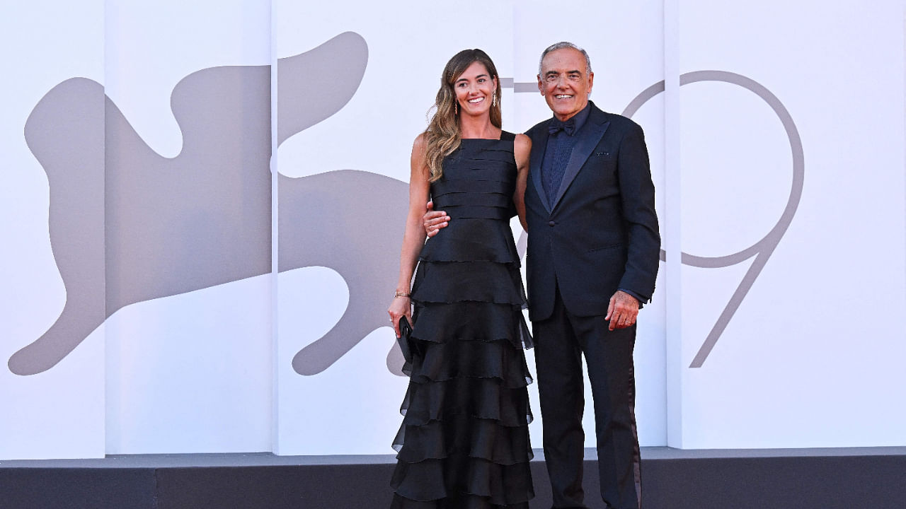 Director of the 79th Venice International Film Festival, Alberto Barbera and his wife Giulia Rosmarini arrive for the Opening Ceremony and the screening of the film 'White Noise' on August 31, 2022. Credit: AFP Photo