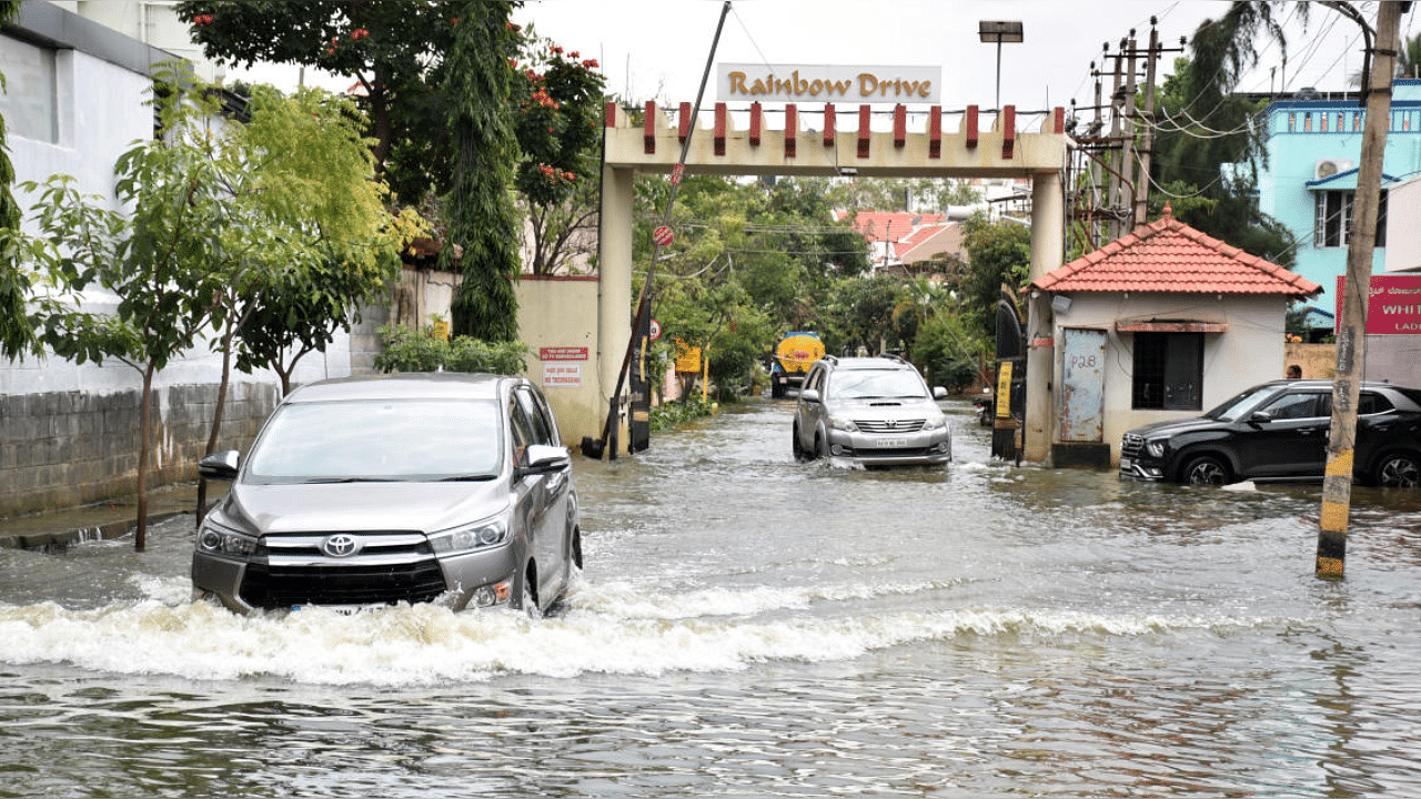 A waterlogged stretch at Rainbow Drive Layout on Sarjapur Road. Credit: DH Photo/B K Janardhan