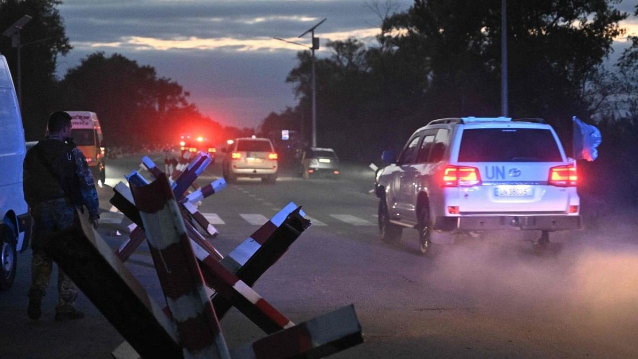 UN vehicles transporting members of International Atomic Energy Agency (IAEA) inspection mission drive on a road outside Zaporizhzhia city. Credit: AFP Photo