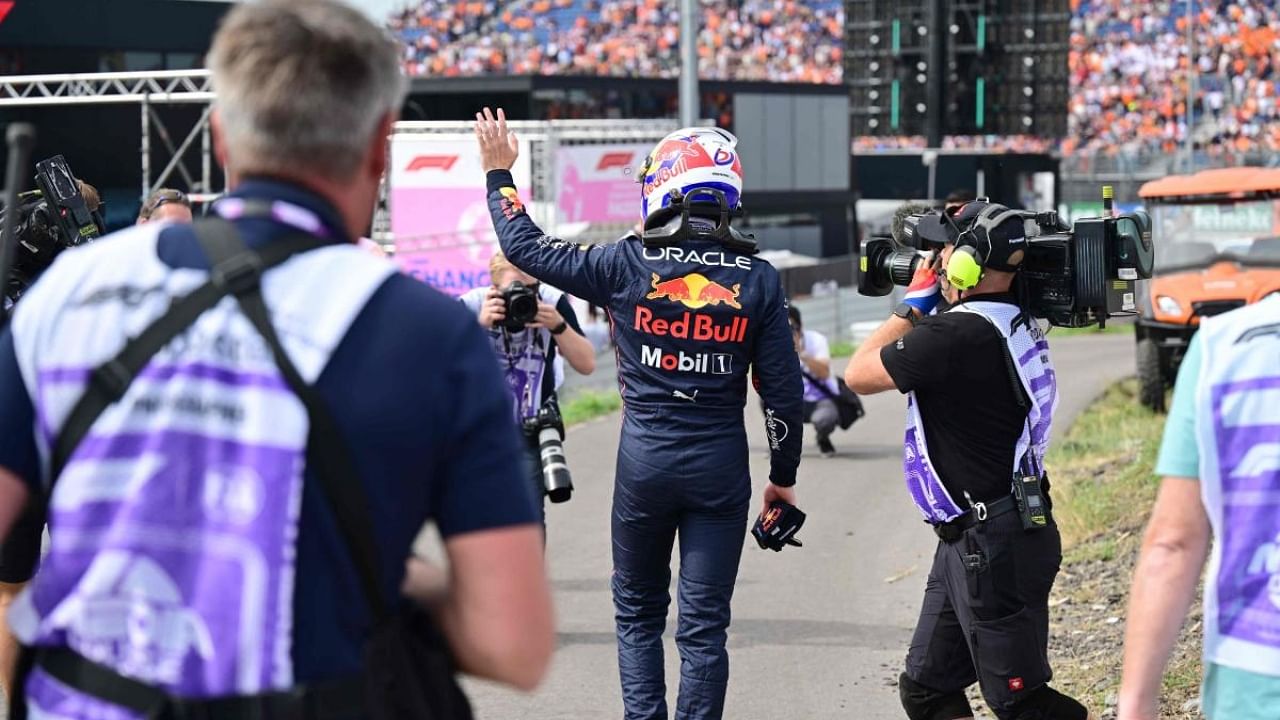 Red Bull Racing's Dutch driver Max Verstappen walks out the track after he stopped on the track following a gearbox issue during the first free practice session ahead of the Dutch Formula One Grand Prix. Credit: AFP Photo