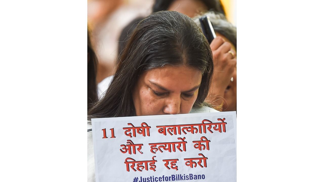 Actress Shabana Azmi holds a placard during a protest against remission of the sentence given to the convicts of Bilkis Bano's case by Gujarat government, at Jantar Mantar in New Delhi. Credit: PTI Photo