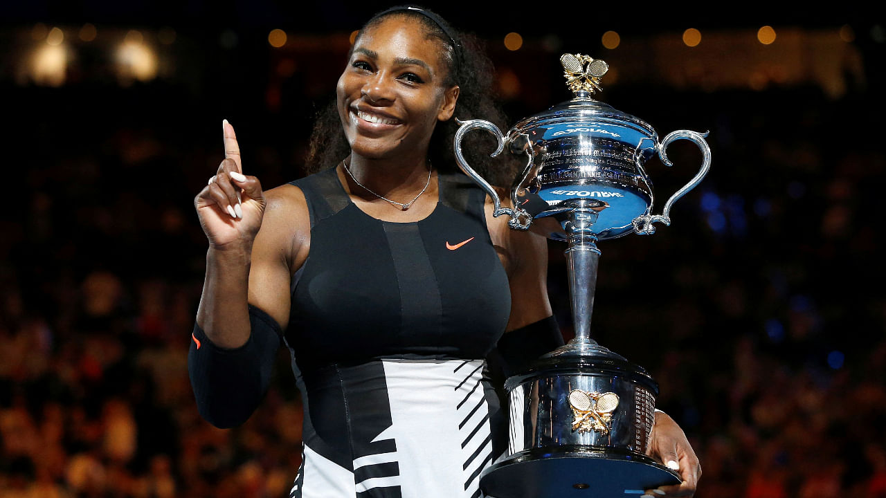 Serena Williams gestures while holding her trophy after winning her Women's Singles final match against Venus Williams in the Australian Open, January 28, 2017. Credit: Reuters File Photo