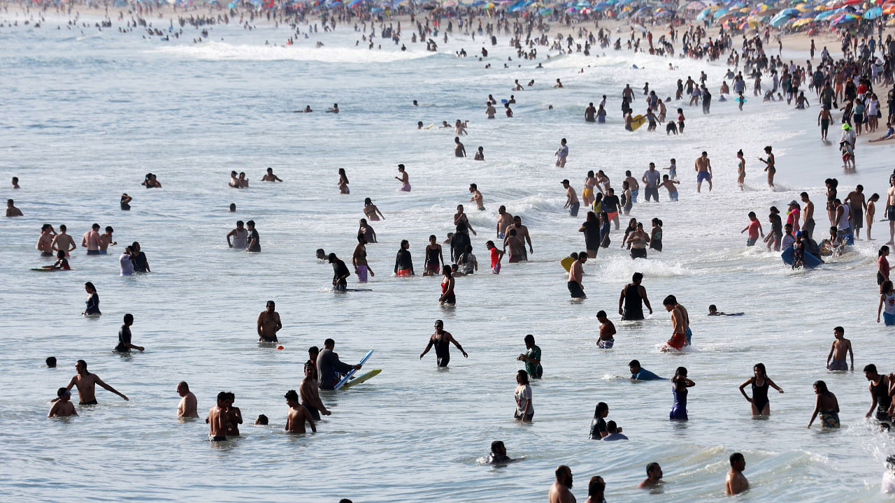 People cool off in the ocean along Santa Monica beach amid an intense heat wave in Southern California on September 4, 2022. Credit: AFP Photo