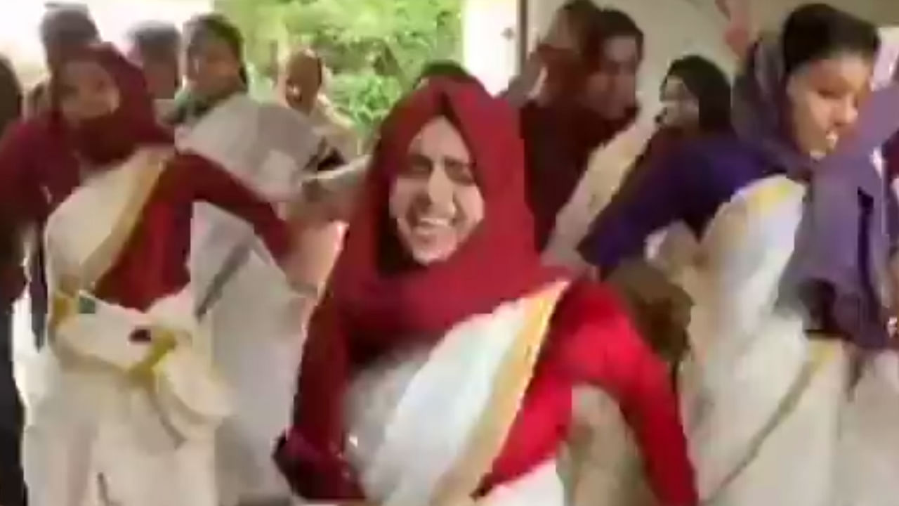 A still from the viral video shows students in hijabs celebrating Onam. Credit: Screen grab from video/Twitter/@ashoswai