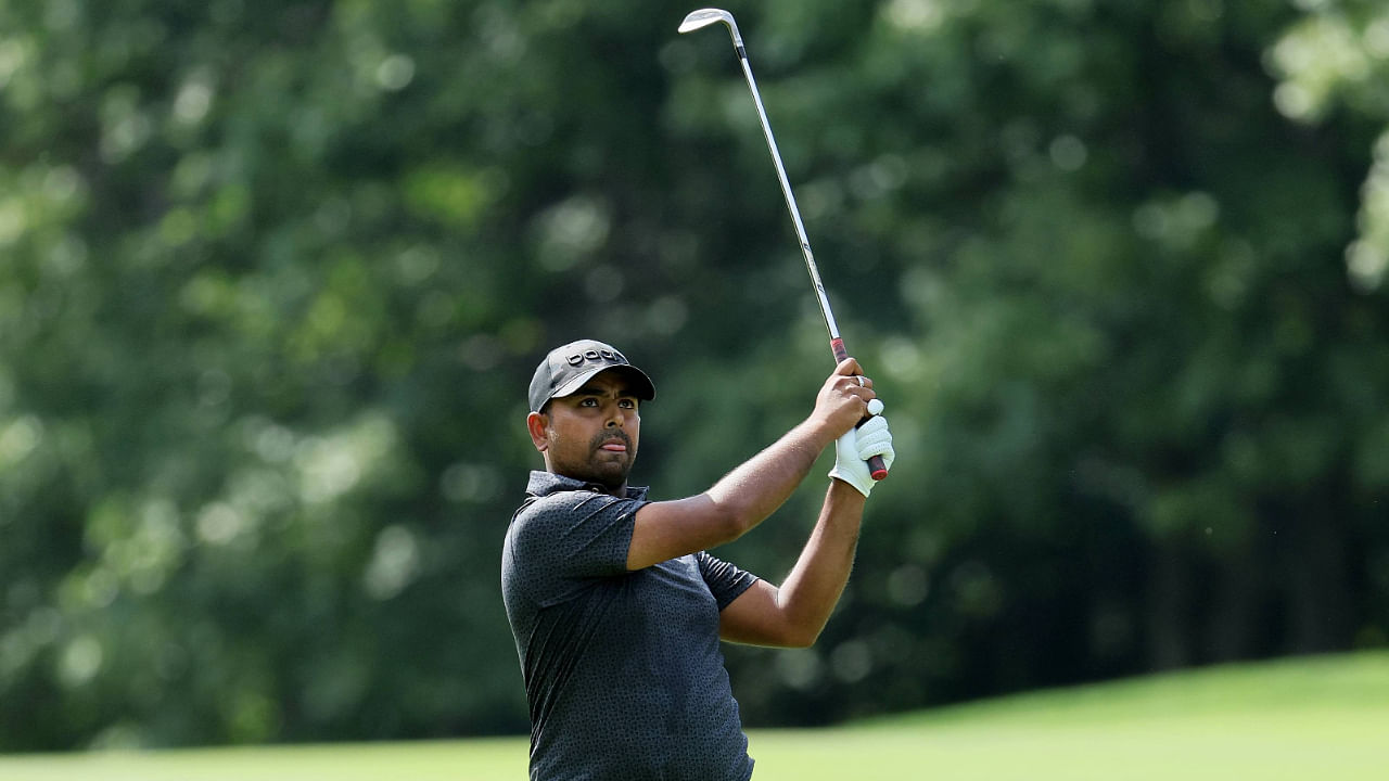 Anirban Lahiri of India hits his second shot on the third hole during Day Three of the LIV Golf Invitational. Credit: AFP Photo
