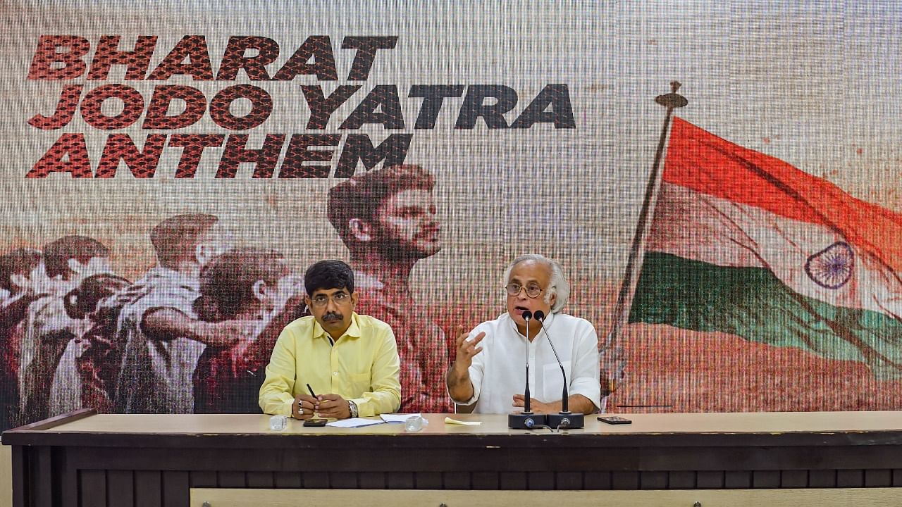 Congress leader Jairam Ramesh with Vineet Punia addresses a press conference at the launch of 'Bharat Jodo Yatra' anthem at AICC headquarters, in New Delhi. Credit: PTI Photo