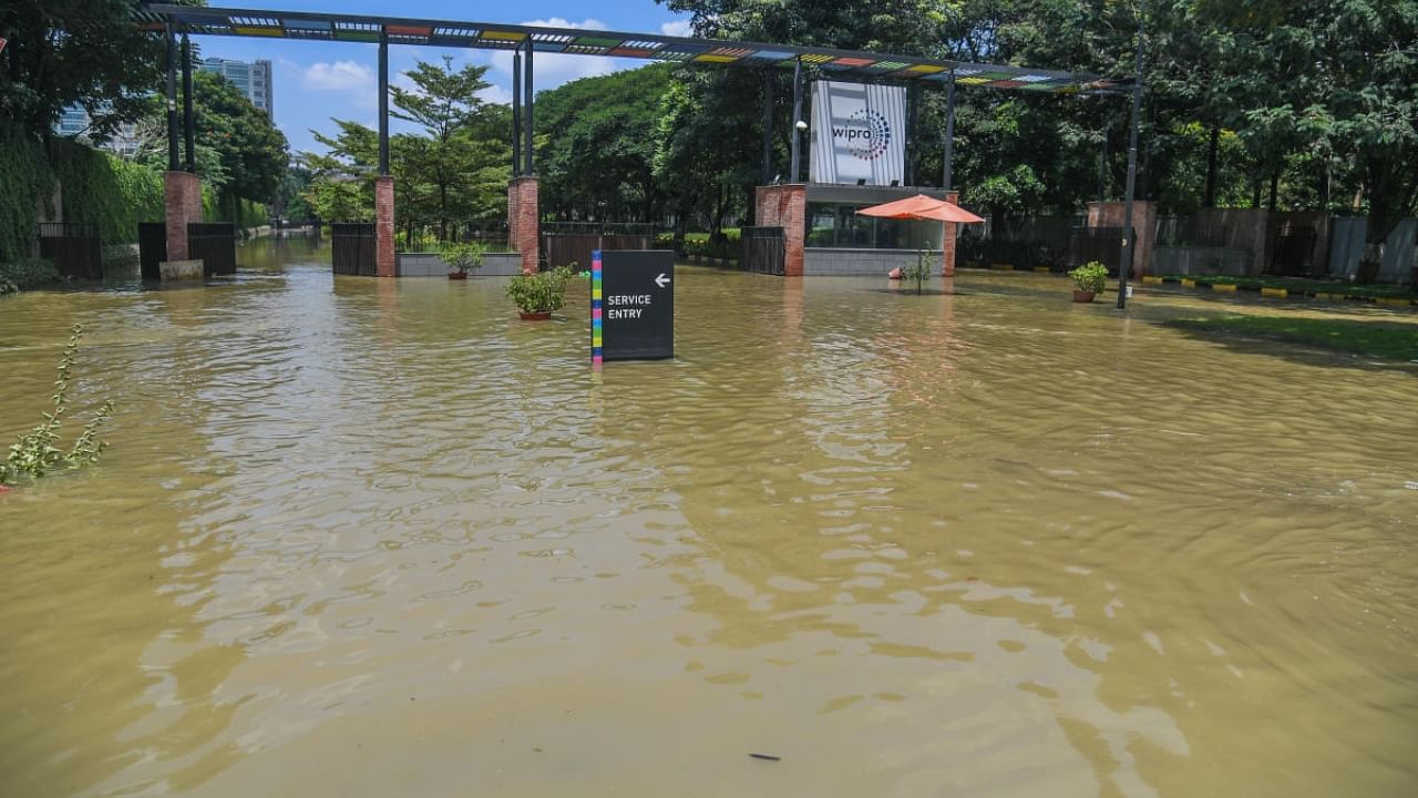 Due to heavy rain, Rain water flooded on road at Wipro gate, Sarjapura main road in Bengaluru on Monday, 05th September 2022. Credit: DH Photo/ S K Dinesh