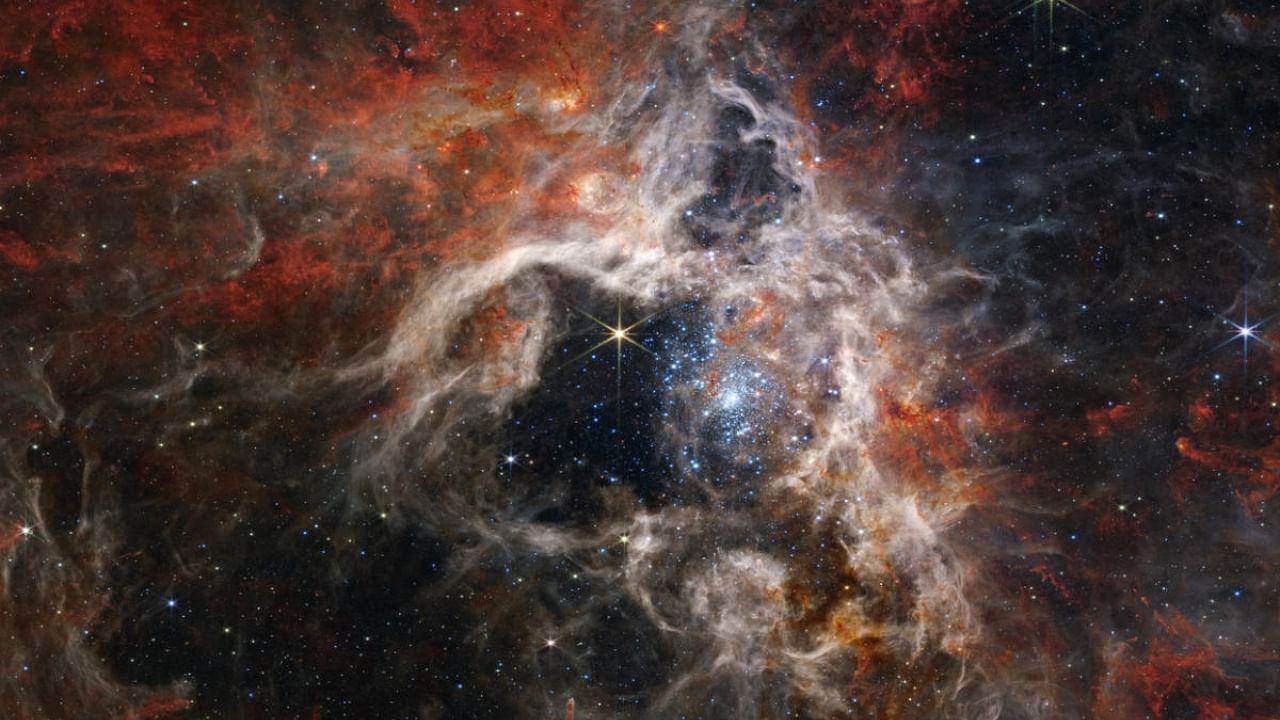 A stellar nursery nicknamed the Tarantula Nebula has been captured in crisp detail by NASA's Webb telescope, revealing never-before-seen features that deepen scientific understanding, the agency said on September 6, 2022. Credit: AFP Photo