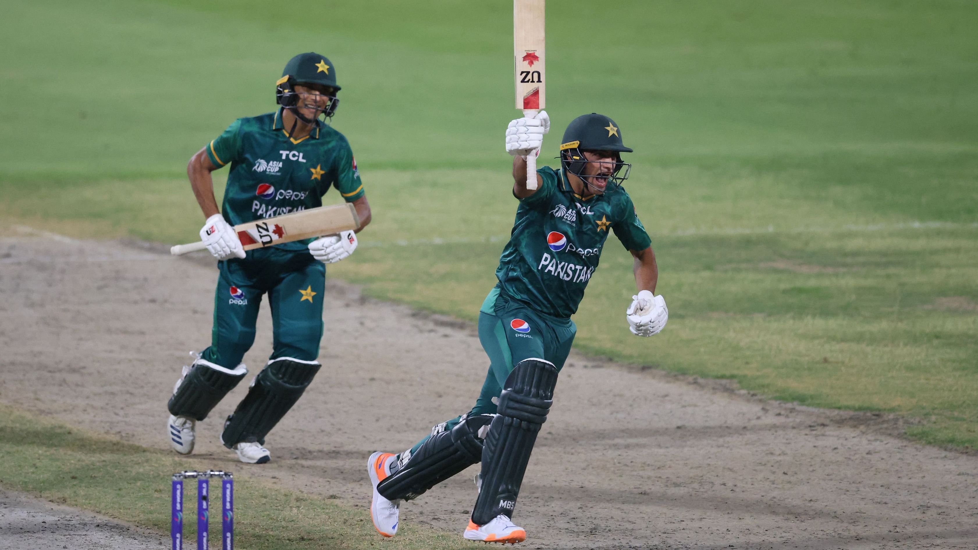 Pakistan's Naseem Shah (R) celebrates after hitting a boundary. Credit: AFP Photo