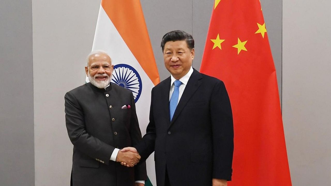 Prime Minister Narendra Modi shakes hands with Chinese President Xi Jinpin. Credit: PTI File Photo