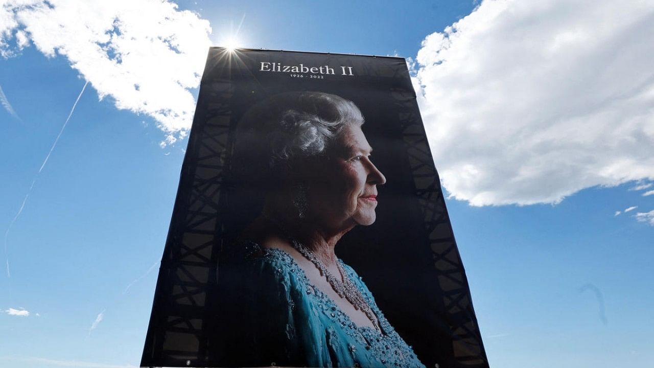 A giant portrait of Queen Elizabeth is seen on the Promenade des Anglais during a ceremony, following the passing of Britain's Queen Elizabeth II. Credit: Reuters Photo