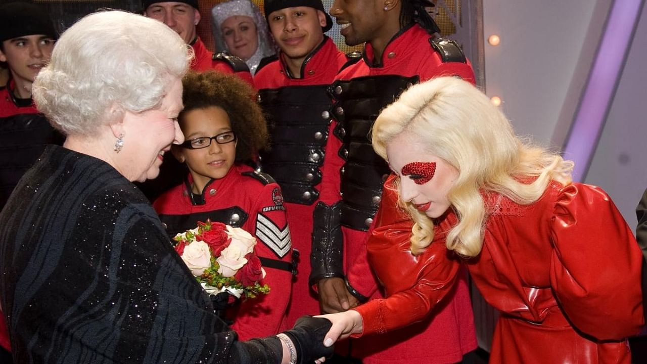 In this file photo taken on December 7, 2009 Britain's Queen Elizabeth II (L) meets American singer Lady Gaga (R) following the Royal Variety Performance in Blackpool, England. Credit: AFP Photo