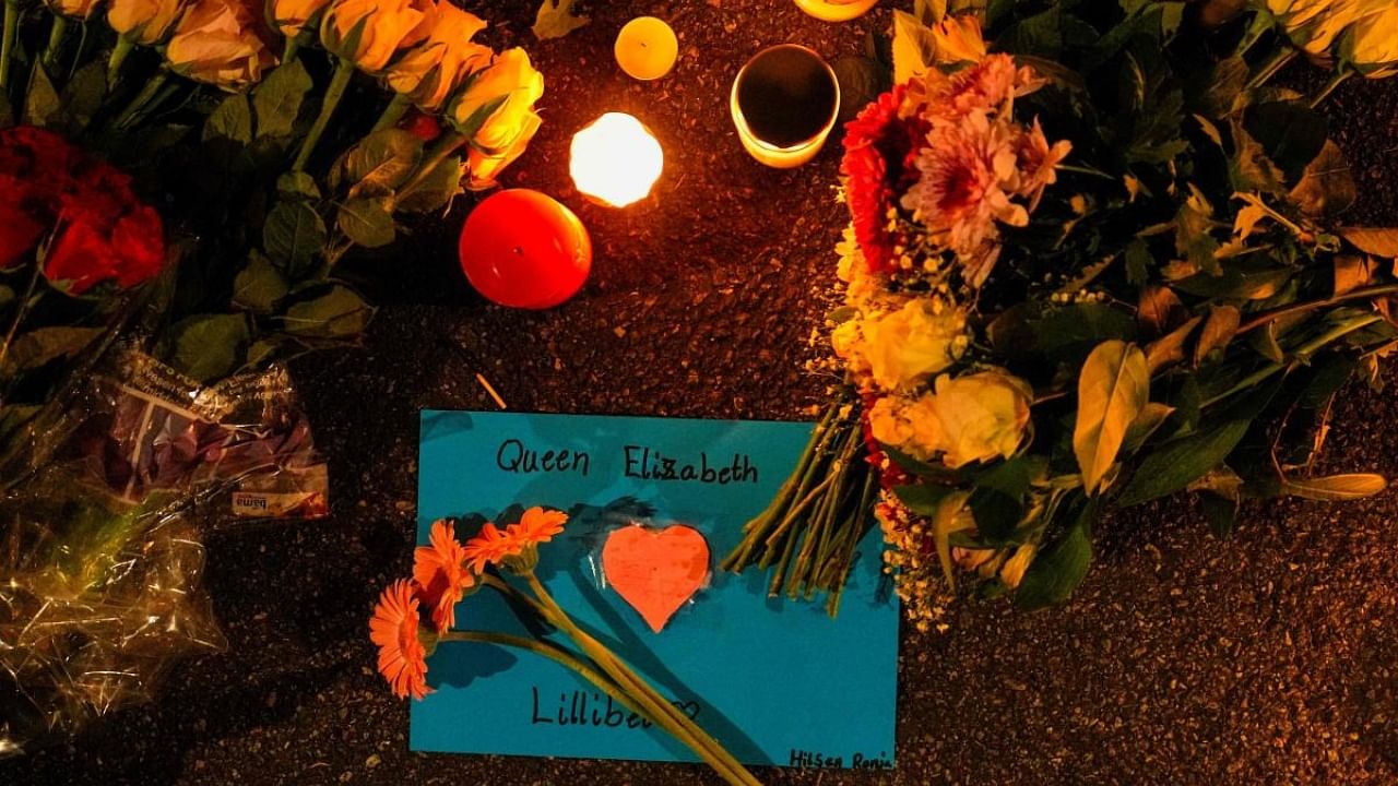 Candles, flowers and a card have been placed outside the British embassy in Oslo after the annoucement of the death of Queen Elizabeth II, on September 8, 2022. - Queen Elizabeth II, the longest-serving monarch in British history, has died aged 96, Buckingham Palace said on September 8, 2022. Credit: AFP Photo
