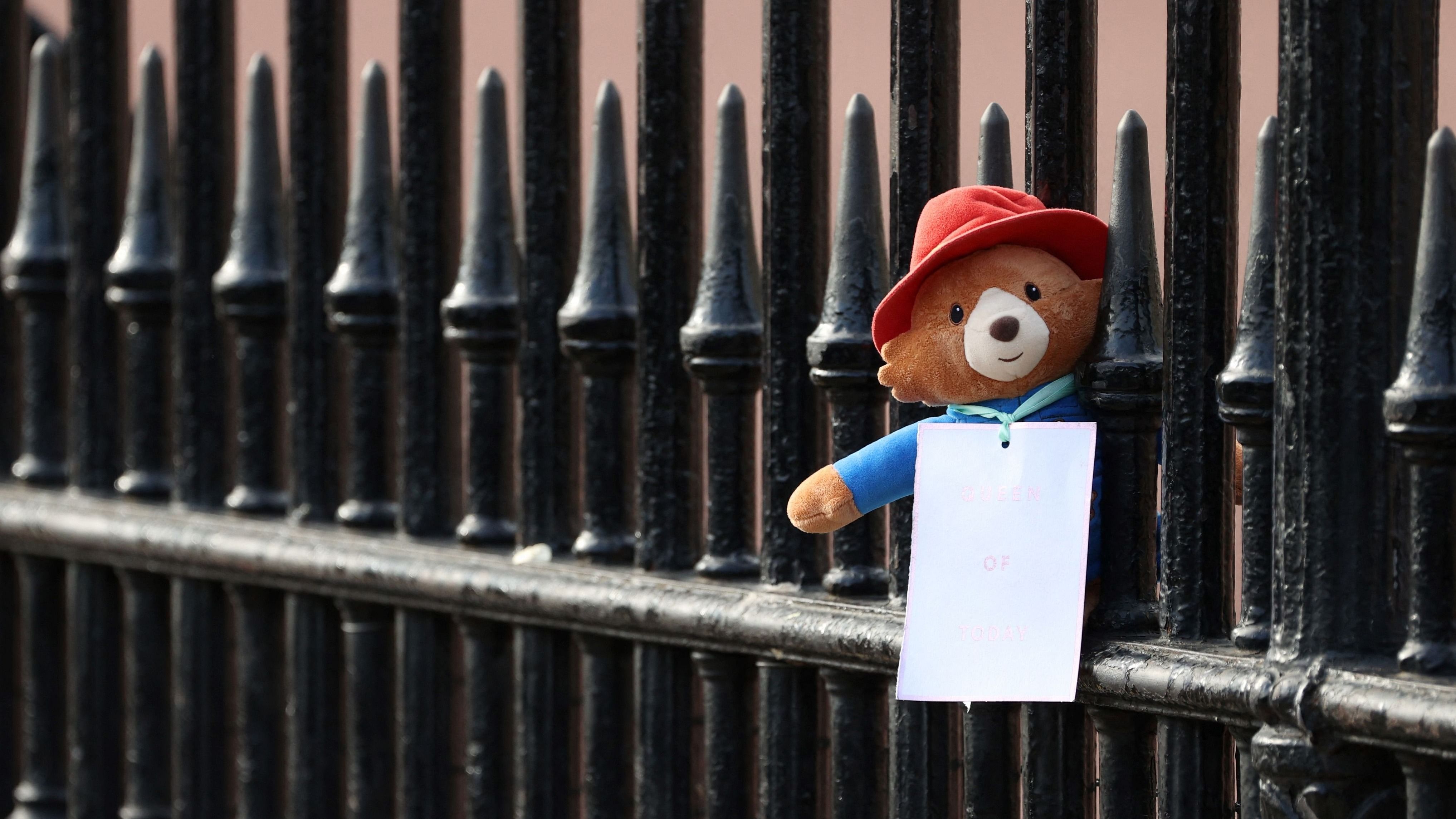 In a video aired by the BBC in June this year, shows the bear joining the late monarch for tea in Buckingham Palace. Credit: AFP Photo