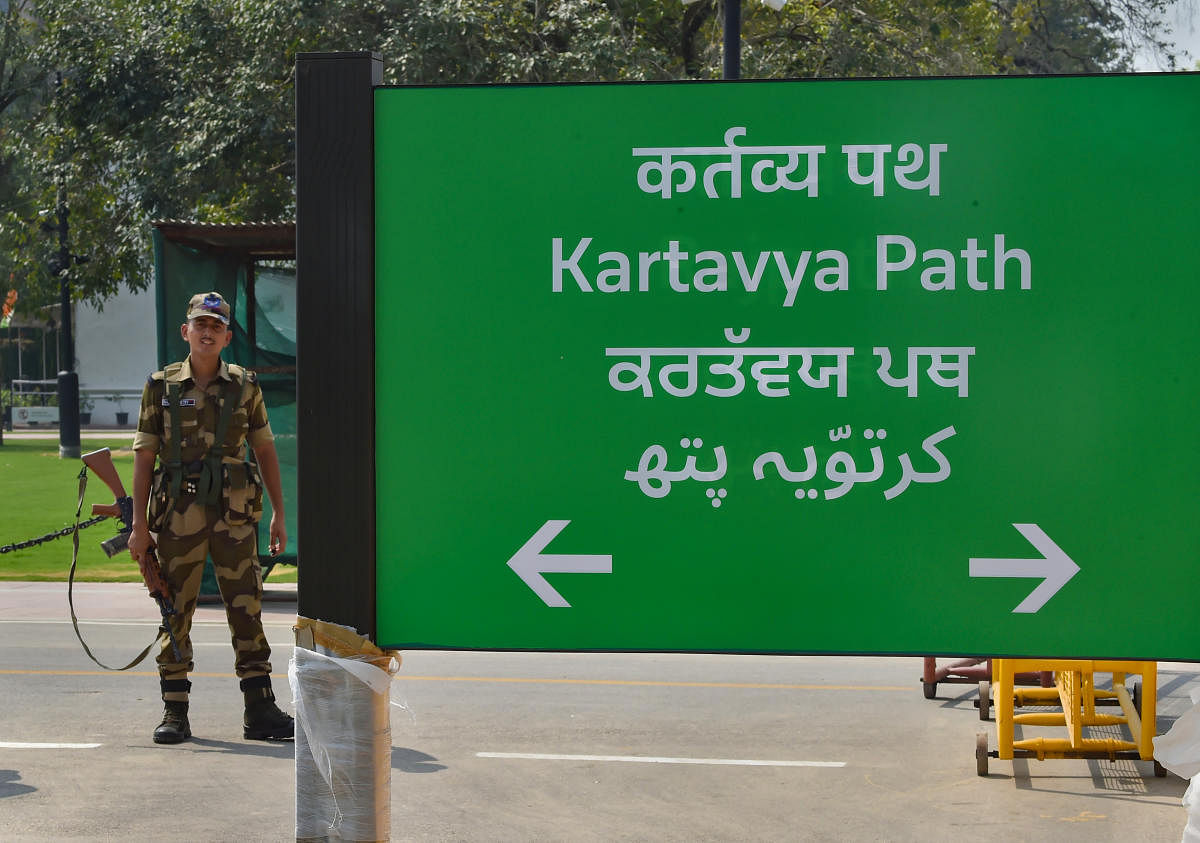 A security person guards near the new signboard bearing 'Kartavya Path' following the change of Rajpath to Kartavya Path, in New Delhi, Thursday, Sept. 8, 2022. Credit: PTI Photo