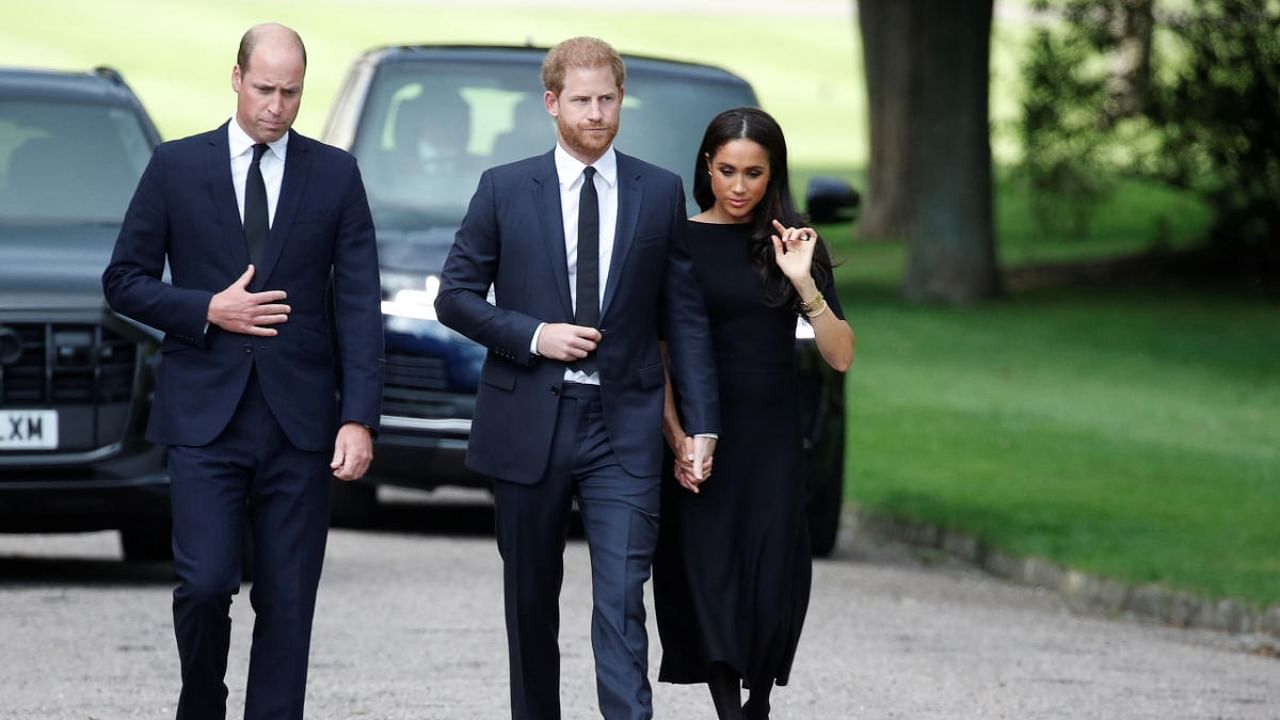 Britain's William, Prince of Wales, Prince Harry and Meghan, the Duchess of Sussex, walk outside Windsor Castle, following the passing of Britain's Queen Elizabeth, in Windsor, Britain. Credit: Reuters Photo