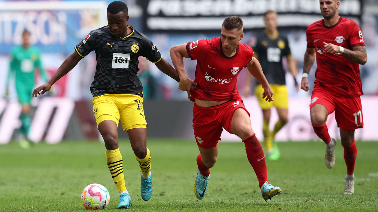 Dortmund's Youssoufa Moukoko vies for the ball against Leipzig's Willi Orban, September 10, 2022. Credit: AFP Photo