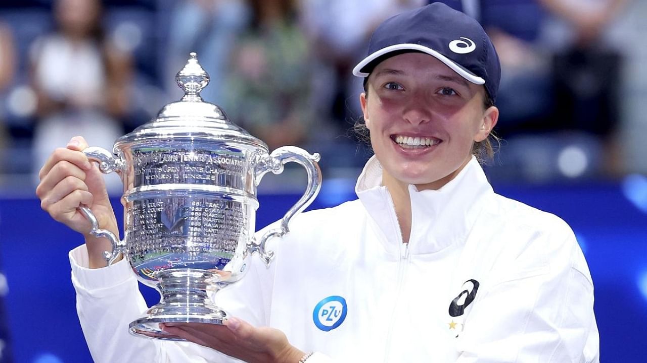  Iga Swiatek of Poland celebrates with the championship trophy after defeating Ons Jabeur of Tunisia during their Women’s Singles Final match on Day Thirteen of the 2022 US Open at USTA Billie Jean King National Tennis Center on September 10, 2022 in the Flushing neighborhood of the Queens borough of New York City. Credit: AFP Photo