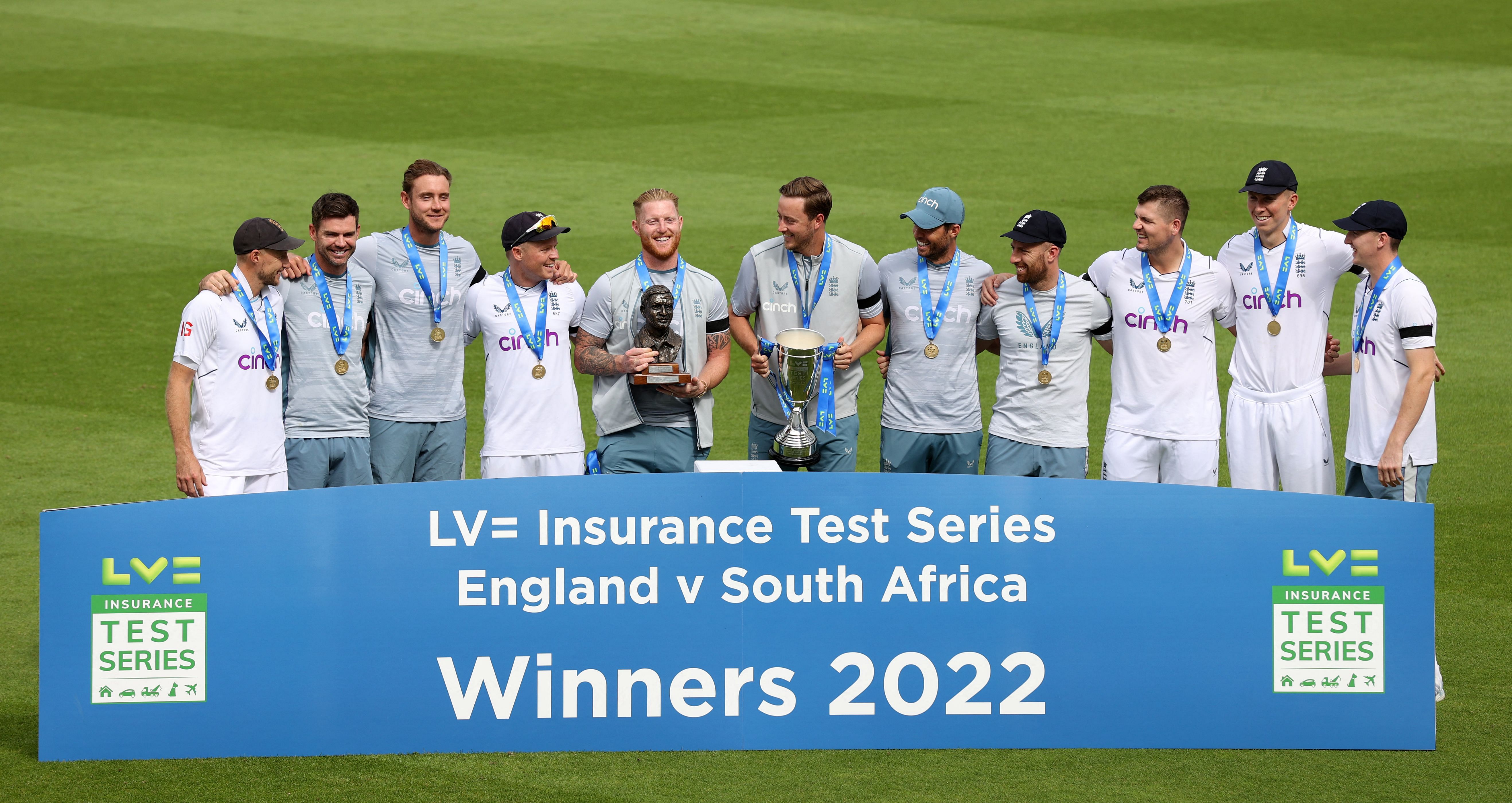 England's captain Ben Stokes (C) holds The Basil D'Oliveira Trophy as he poses with his players (L/R): Joe Root, James Anderson, Stuart Broad, Ollie Pope, Ollie Robinson, Ben Foakes, Jack Leach, Alex Lees, Zak Crawley and Harry Brook after victory on the fifth and final day of the third Test cricket match between England and South Africa at The Oval. Credit: AFP Photo