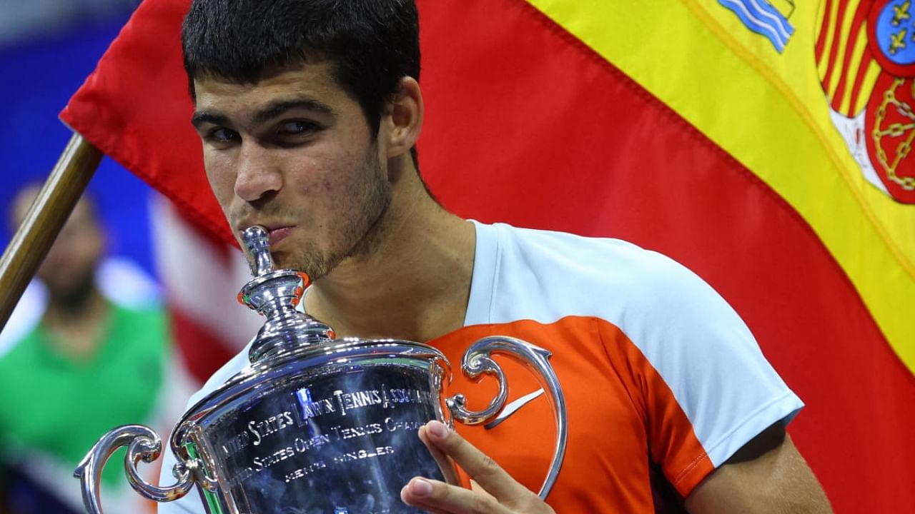 Spain's Carlos Alcaraz celebrates with the trophy after winning the US Open. Credit: Reuters Photo