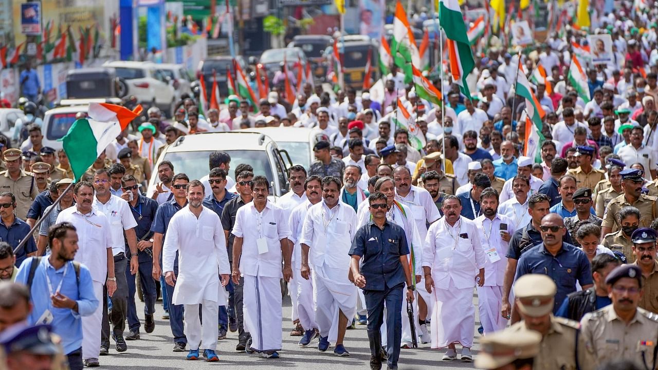 Congress leaders Rahul Gandhi, KC Venugopal, Shashi Tharoor and other party workers during the Bharat Jodo Yatra, in Thiruvananthapuram district. Credit: PTI Photo