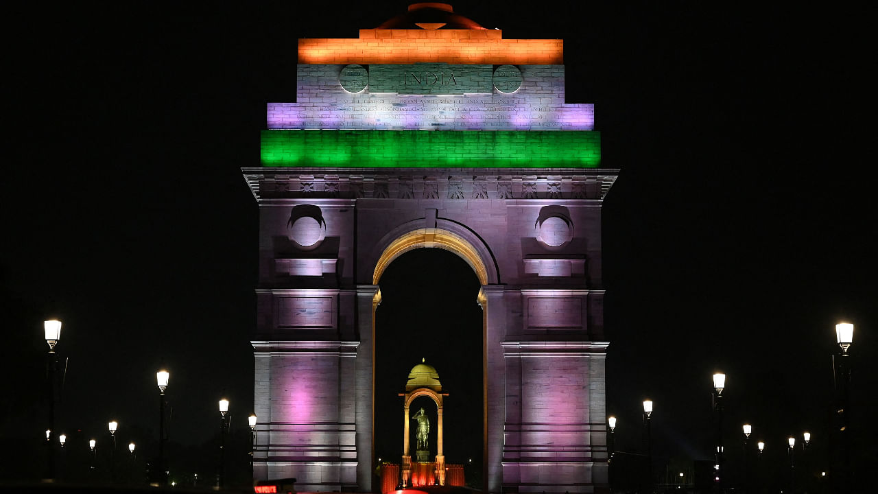 A statue of India's independence hero Subhas Chandra Bose (C) is pictured through India Gate after the recent inauguration of the newly renovated avenue ‘Central Vista’ in New Delhi on September 10, 2022. Credit: AFP Photo