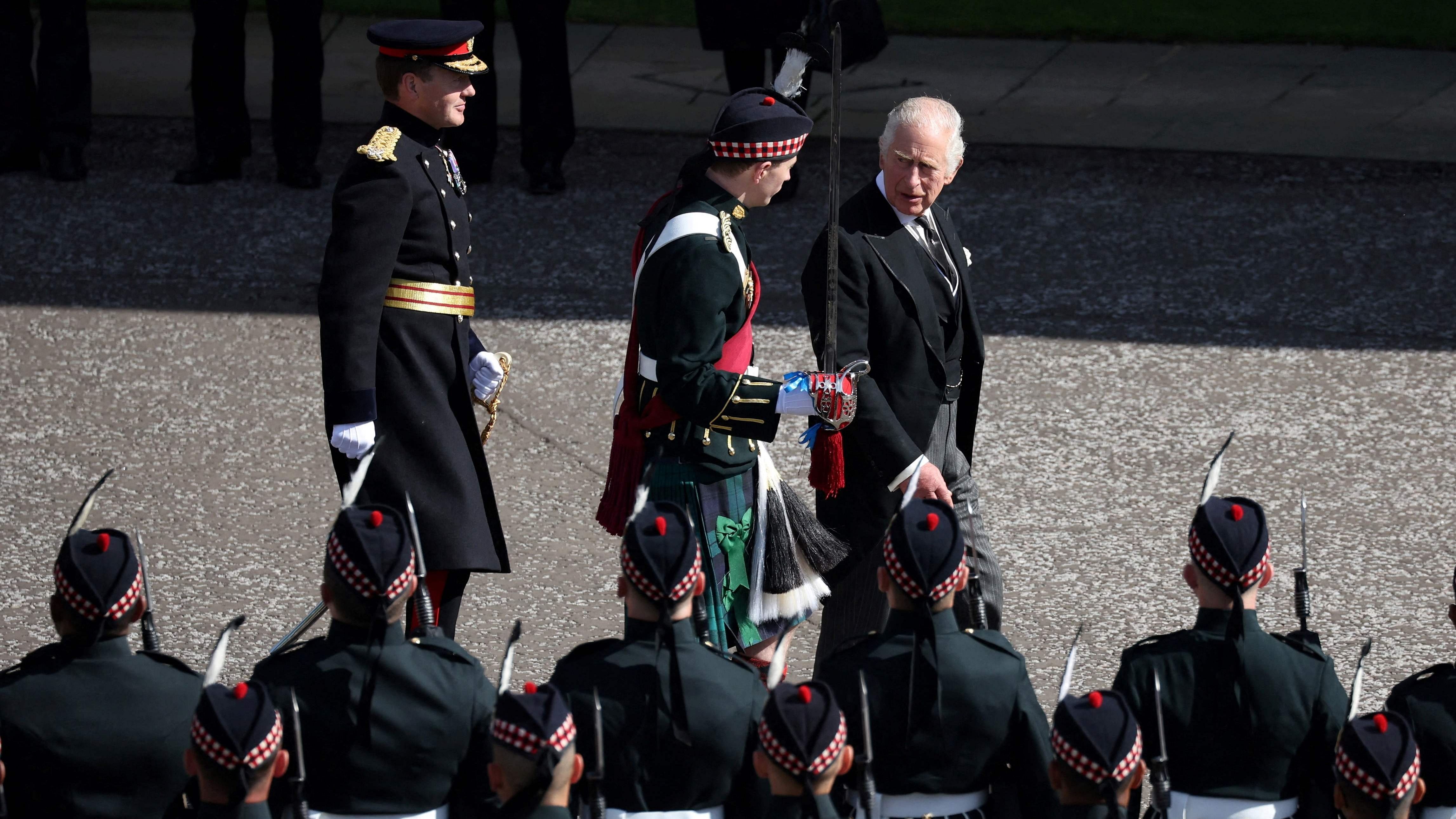 Britain's King Charles III inspects an Honour Guard as he arrives at the Palace of Holyroodhouse, in Edinburgh, on September 12, 2022. Credit: AFP Photo